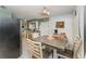 Cozy dining area with tile flooring and a view into the kitchen at 520 S Orange Ave, Fort Meade, FL 33841