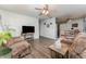 Comfortable living room with wood flooring, a ceiling fan and lots of natural light at 520 S Orange Ave, Fort Meade, FL 33841