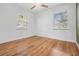 Simple yet comfortable bedroom with light flooring and neutral colors at 407 W Oak Dr, Lakeland, FL 33803