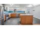 Open-concept kitchen with modern appliances, light countertops, and sleek cabinetry at 407 W Oak Dr, Lakeland, FL 33803