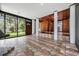 Open floor plan with tile flooring, wood accents, large windows, and seamless flow to the backyard at 407 W Oak Dr, Lakeland, FL 33803