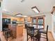 Well-lit kitchen featuring stainless steel appliances, ample cabinetry, and a breakfast bar at 4845 Sw 78Th Ave, Bushnell, FL 33513