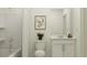 Bright bathroom with a shower-tub, stylish vanity, and clean, neutral finishes at 772 Osprey Roost Dr, Lakeland, FL 33801