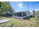 Large screened in back porch and fenced yard offer a private outdoor living space at 1126 Waterview E Blvd, Lakeland, FL 33801