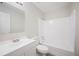 A clean bathroom boasts a modern vanity, toilet, and a bathtub with a shower at 1126 Waterview E Blvd, Lakeland, FL 33801