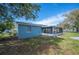 Back of property featuring a screened lanai perfect for outdoor entertaining or relaxation at 1126 Waterview E Blvd, Lakeland, FL 33801