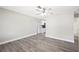 Bright living room featuring new flooring and a ceiling fan at 1126 Waterview E Blvd, Lakeland, FL 33801