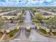 Aerial view of a neighborhood with manicured landscaping at the entrance at 5335 River Rock Rd, Lakeland, FL 33809