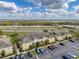 Aerial view of two-story homes with parking and landscaped surroundings at 5335 River Rock Rd, Lakeland, FL 33809