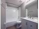 Bathroom featuring a shower and tub, toilet, sink and vanity, and a mirror at 5335 River Rock Rd, Lakeland, FL 33809