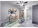 Bedroom with a desk, bookshelf and closet with mirror doors over a carpeted floor at 5335 River Rock Rd, Lakeland, FL 33809