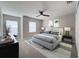 Bright bedroom with modern decor, a ceiling fan and large windows at 5335 River Rock Rd, Lakeland, FL 33809