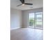 An empty bedroom features a large window and a private balcony at 5335 River Rock Rd, Lakeland, FL 33809