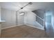 A modern light fixture illuminates the dining room, complemented by beautiful wood-look flooring and access to the stairs at 5335 River Rock Rd, Lakeland, FL 33809