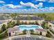 Aerial view of swimming pool surrounded by palm trees and lounge chairs at 5335 River Rock Rd, Lakeland, FL 33809