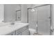 Bathroom with vanity and walk-in shower with glass door at 5646 Nevis Ter, Kissimmee, FL 34758