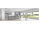 Open-concept kitchen with gray cabinets, island, and sliding doors showcasing backyard views at 5646 Nevis Ter, Kissimmee, FL 34758