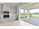 Modern kitchen with stainless steel appliances, sleek gray cabinets, and a scenic outdoor view at 5646 Nevis Ter, Kissimmee, FL 34758