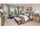 Relaxing main bedroom featuring bay windows, neutral decor, and soft natural light at 5646 Nevis Ter, Kissimmee, FL 34758