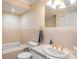 Bathroom with tile walls, a large mirror, and a vanity sink at 915 E Lake Parker Dr, Lakeland, FL 33801