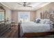 Bedroom showcasing hardwood floors, ceiling fan, and access to the outdoors at 915 E Lake Parker Dr, Lakeland, FL 33801