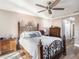 Main bedroom with hardwood floors and a decorative wrought iron bed frame at 915 E Lake Parker Dr, Lakeland, FL 33801