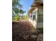 Backyard featuring palm trees and partial view of the home's exterior at 1135 Linkside Ct, Apopka, FL 32712