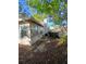Backyard showing home's exterior with windows and patio door at 1135 Linkside Ct, Apopka, FL 32712