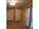 Cozy bedroom with closet space and a sliding glass door, providing natural light and charm at 1135 Linkside Ct, Apopka, FL 32712