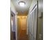 Well-lit hallway featuring closet space and access to multiple rooms at 1135 Linkside Ct, Apopka, FL 32712