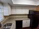 Well-lit kitchen with granite countertops, black appliances, and ample counter space at 1135 Linkside Ct, Apopka, FL 32712