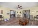 Sun room with wood-look floors, a ceiling fan, and slider doors to the outside at 19797 Sw 85Th Ln, Dunnellon, FL 34432