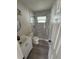 Modern bathroom featuring a vanity with modern fixtures, a stylish glass-enclosed shower with marble tiling at 1460 Marvin C Zanders Ave, Apopka, FL 32703