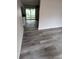 Open living room with updated flooring, sliding glass doors, and fresh paint at 1460 Marvin C Zanders Ave, Apopka, FL 32703