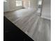 Bright and airy living room with modern flooring and a welcoming entryway at 1460 Marvin C Zanders Ave, Apopka, FL 32703