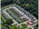 Aerial view shows a property lot in a residential community surrounded by nature at 1908 Rosewood Cir, Lakeland, FL 33810
