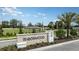 Ironwood community sign with landscaping and view of neighborhood homes at 1908 Rosewood Cir, Lakeland, FL 33810