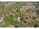 Aerial shot of a secluded home surrounded by mature landscaping at 2920 Ewell Rd, Lakeland, FL 33811