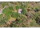 Aerial shot of a home surrounded by trees and lush natural landscape at 2920 Ewell Rd, Lakeland, FL 33811