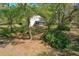 A backyard view displays a screened in porch and lush landscaping at 2920 Ewell Rd, Lakeland, FL 33811