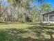 Expansive backyard with mature trees offering shade and privacy at 2920 Ewell Rd, Lakeland, FL 33811
