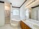 Bathroom featuring a shower, garden tub, and a double vanity at 2920 Ewell Rd, Lakeland, FL 33811