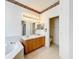Bathroom featuring a bath tub, double vanity, and view into toilet area at 2920 Ewell Rd, Lakeland, FL 33811