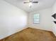 Bedroom with ceiling fan, window, and carpet floors at 2920 Ewell Rd, Lakeland, FL 33811
