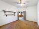 A bedroom featuring shelving, carpet floors, and a view of an adjacent room at 2920 Ewell Rd, Lakeland, FL 33811