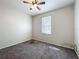 Bedroom has a window and overhead fan with lighting at 2920 Ewell Rd, Lakeland, FL 33811