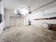 Open two car garage with open ceilings and side shelves for storage at 2920 Ewell Rd, Lakeland, FL 33811