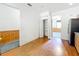 Kitchen area with pantry, wood laminate floors, and views into other rooms at 2920 Ewell Rd, Lakeland, FL 33811