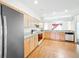 Bright kitchen featuring light wood cabinetry, modern appliances, and a functional layout at 2920 Ewell Rd, Lakeland, FL 33811