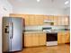 Bright kitchen featuring light wood cabinetry, modern appliances, and plenty of counter space at 2920 Ewell Rd, Lakeland, FL 33811